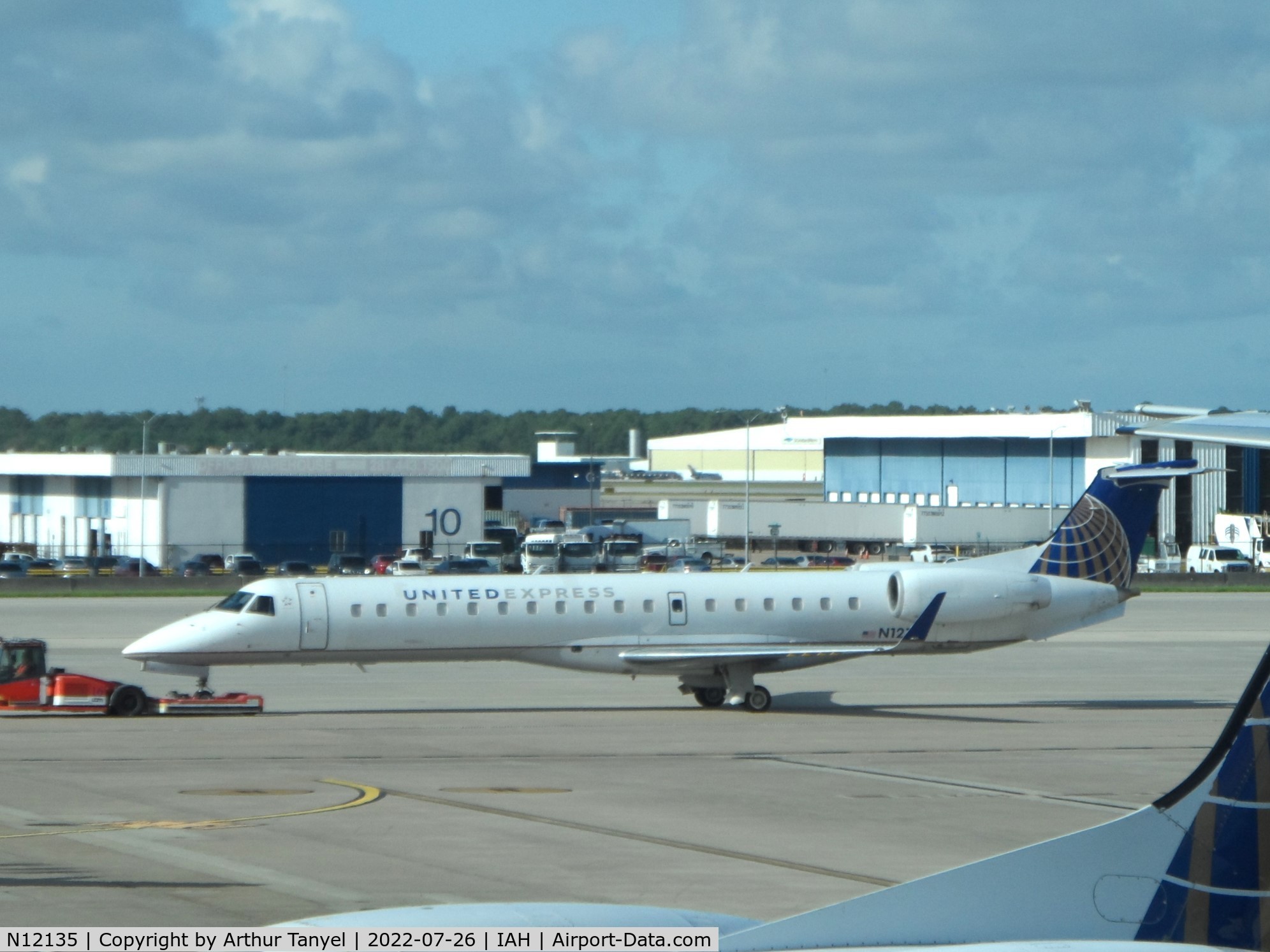 N12135, 2003 Embraer ERJ-145XR (EMB-145XR) C/N 145718, Being towed at IAH