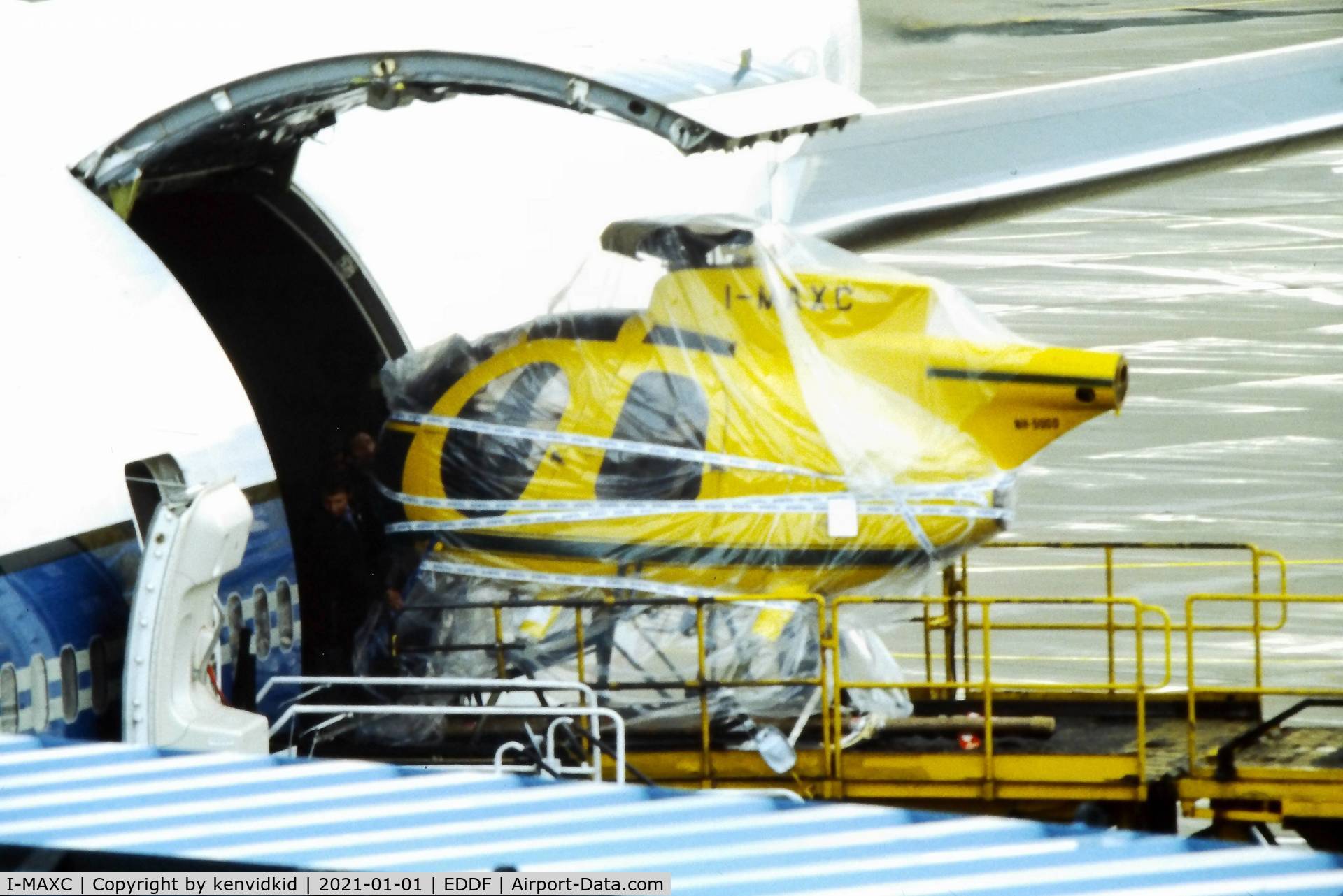 I-MAXC, Hughes 369D C/N 400688D, Being loaded into a Varig Boeing 747 at Frankfurt, early 1980's.