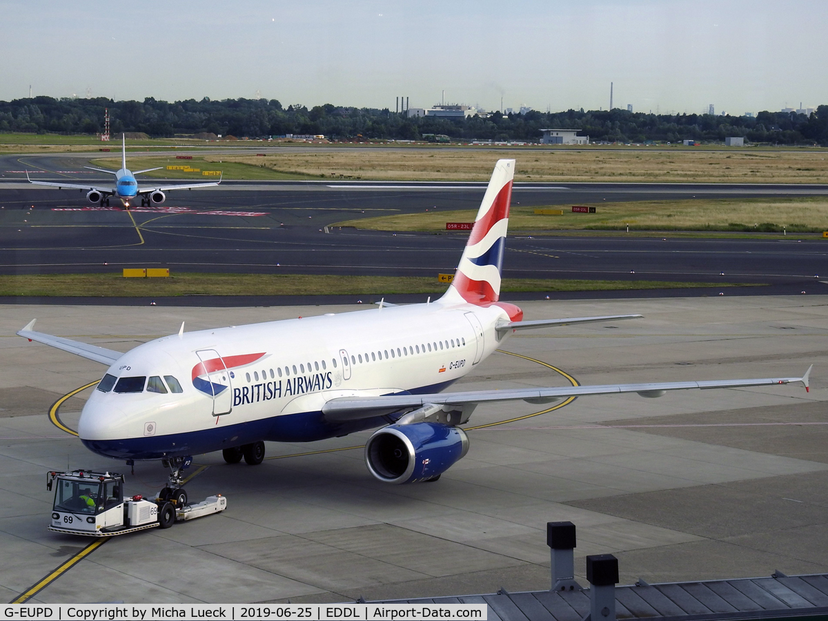 G-EUPD, 1999 Airbus A319-131 C/N 1142, PH-EZW in the background