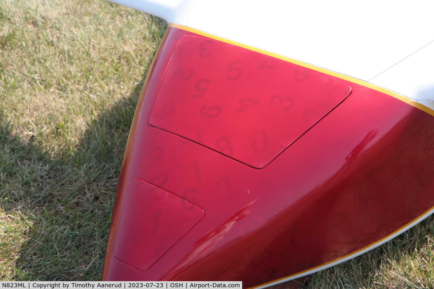 N823ML, 2021 COZY MKIV C/N 0049, 2021 COZY MKIV, c/n: 0049, AirVenture 2023.  Lucky Numbers.  Silver numbers were applied first, then an overcoat of red paint was applied.