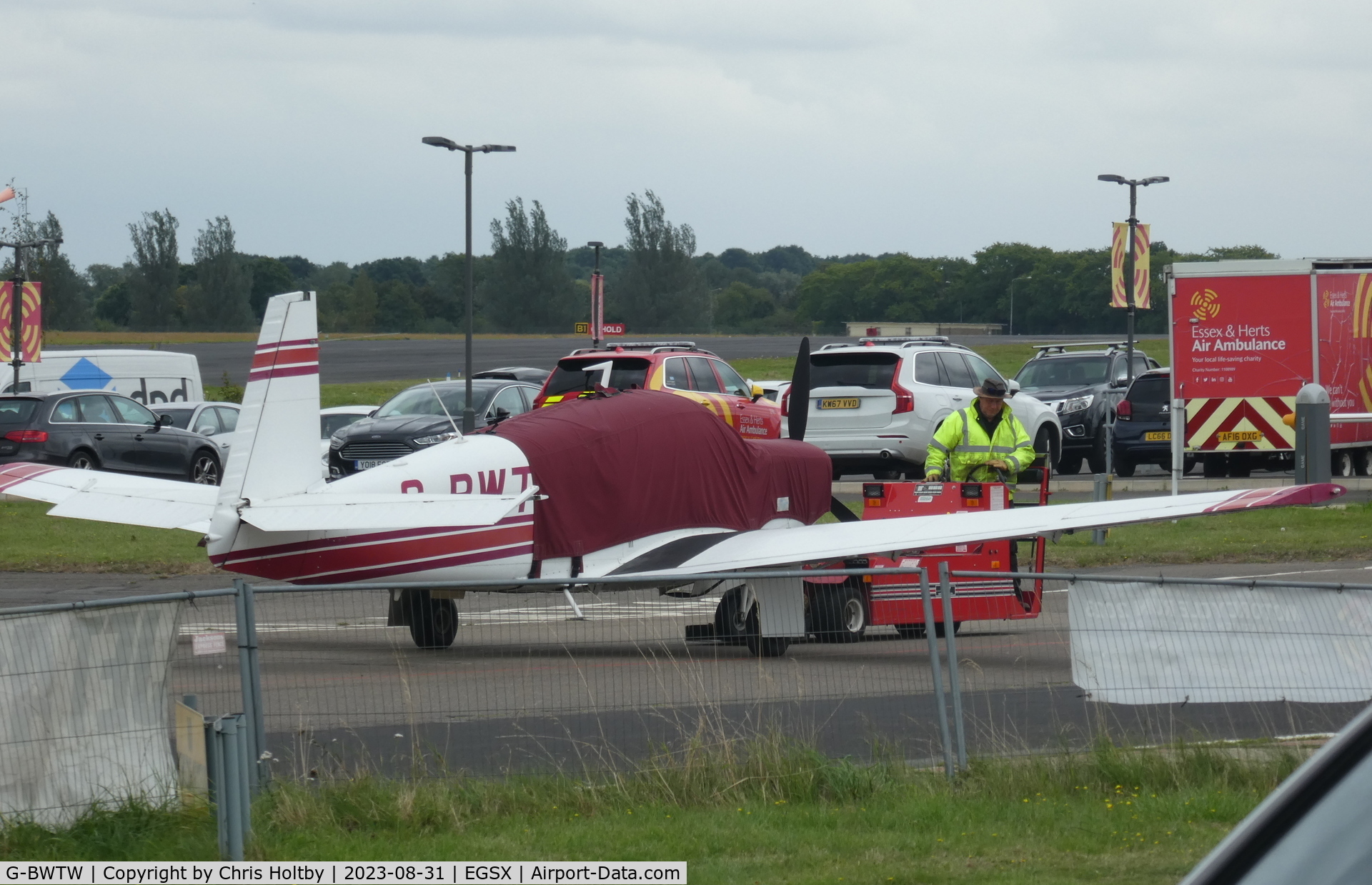 G-BWTW, 1975 Mooney M20C Ranger C/N 20-1188, Being towed out for take-off at North Weald.
