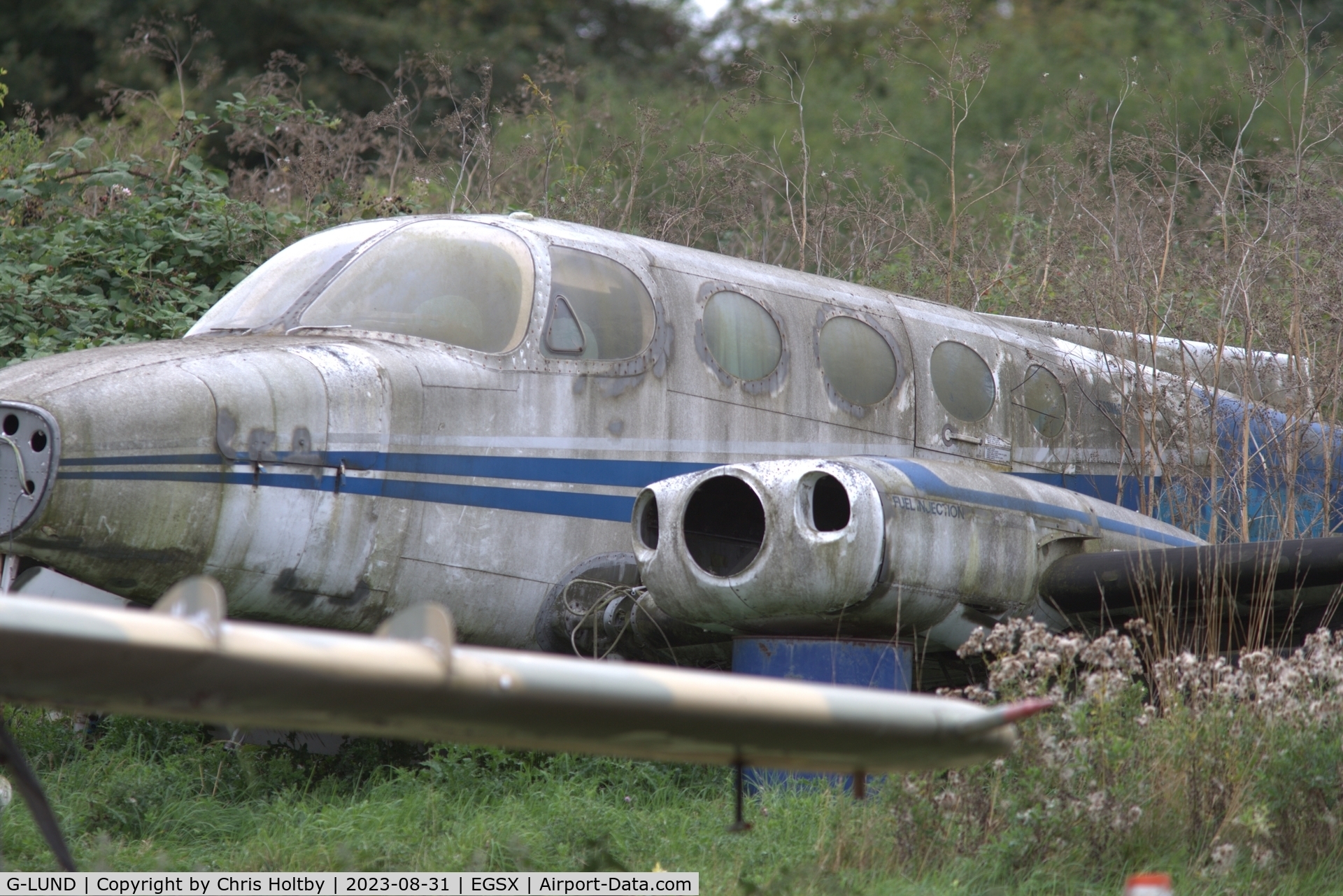 G-LUND, 1973 Cessna 340 C/N 340-0305, Not much left & sinking into the foliage at North Weald, Essex