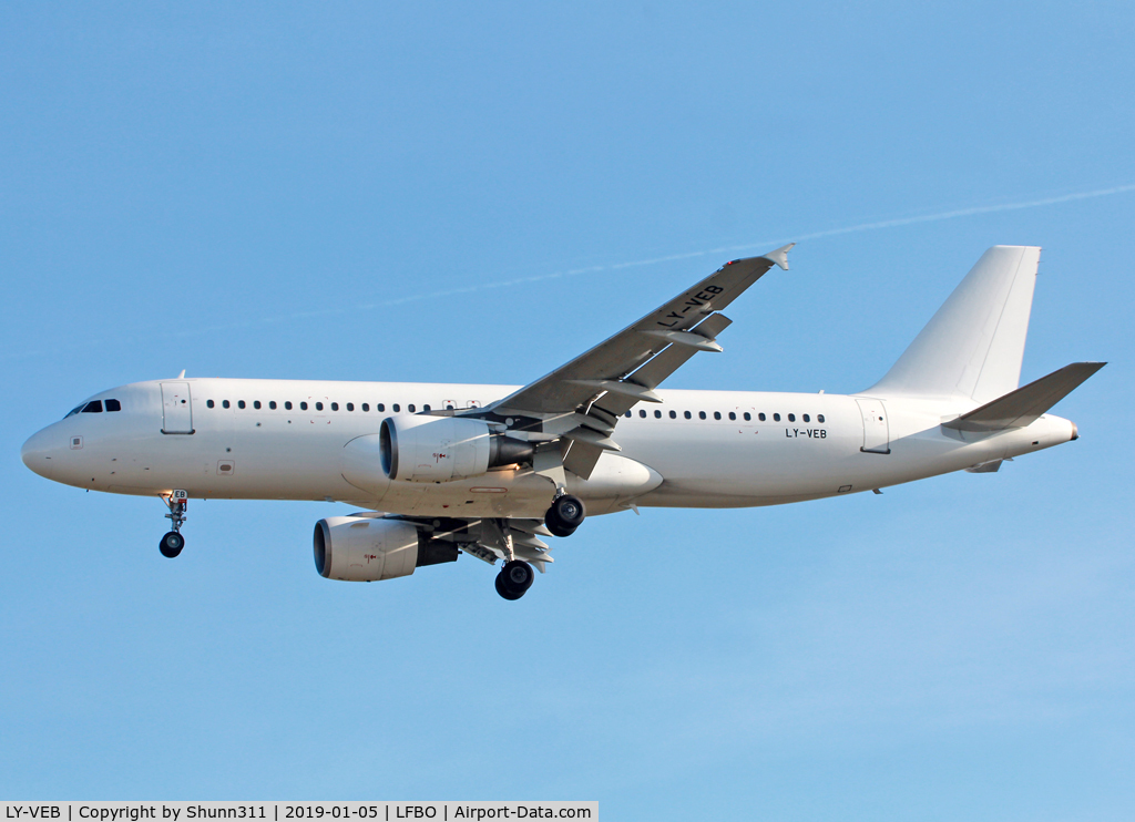 LY-VEB, 2001 Airbus A320-214 C/N 1571, Landing rwy 32L in all white c/s without titles...