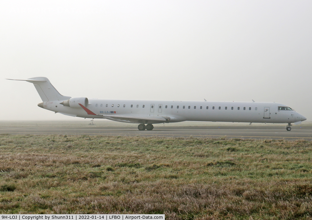 9H-LOJ, 2011 Bombardier CRJ-1000ER NG (CL-600-2E25) C/N 19018, Taxiing holding point rwy 14R for departure... Operated by Mel Air