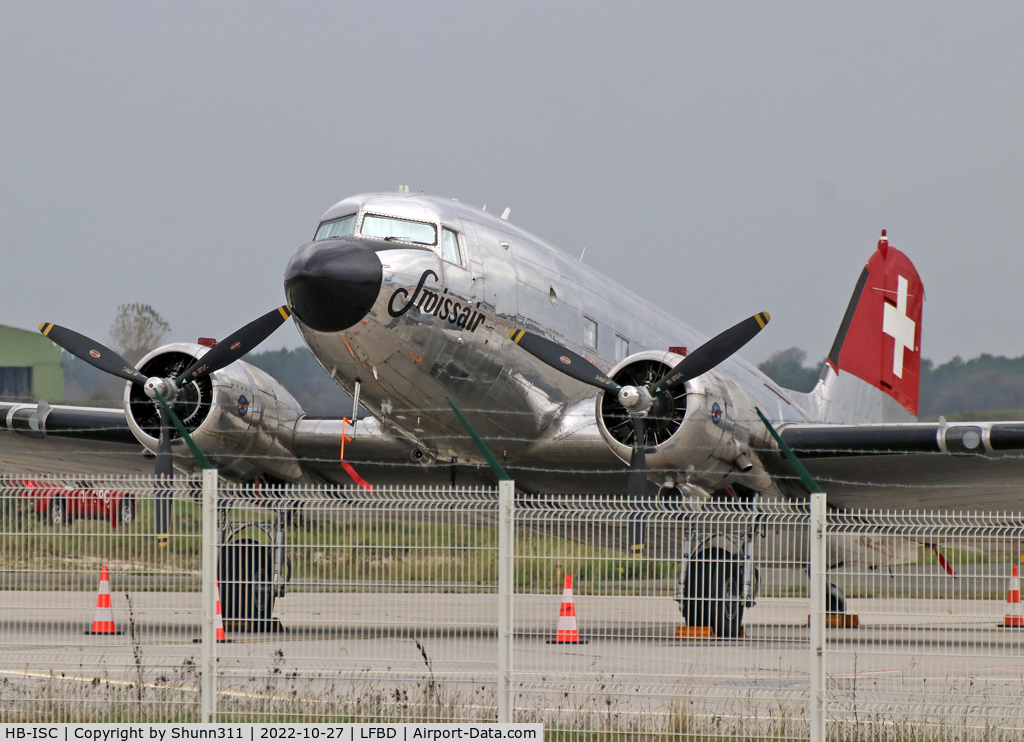 HB-ISC, 1943 Douglas DC-3C-S1C3G (C-47A) C/N 9995, Parked at the Cargo apron and not easy to catch with 2 fences...