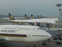 9V-SPN @ SIN - Impressive fleet of B747-400s and B777s of Singapore Airlines at Changi Airport - by Micha Lueck