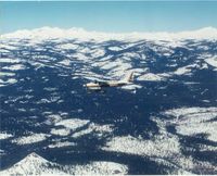 N3105S - Over the Sierra Mountains - by Cleve Potter