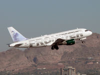 N904FR @ PHX - Just airborne, with Camelback Mountain in the background - by John Meneely