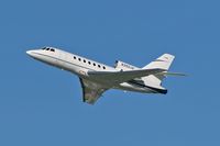 N350JS @ LAX - Departing RWY 25R on a clear December day. - by Dean Heald