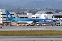 F-OSUN @ LAX - Air Tahiti Nui F-OSUN (A340-313) pushed back from terminal, preparing for departure. - by Dean Heald