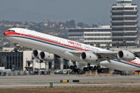 B-6052 @ LAX - A very poor photograph, but it does capture the moment.  China Eastern B-6052 (FLT 586) departing LAX RWY 25R enroute to Shanghai Pudong (ZSPD). - by Dean Heald