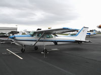N5160U @ HWD - 1980 Cessna 172RG with Top Gun logo at stormy Hayward Air Terminal, CA - by Steve Nation