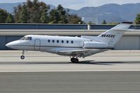 N845QS @ SMO - ExecJet Raytheon Hawker 800XP touching down on RWY 21 after a 41-minute flight from San Francisco (KSFO). - by Dean Heald