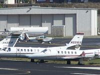 N331QS @ PDK - Long range photo - parked on 16/34 with others - by Michael Martin