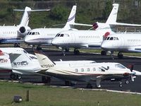 N700AP @ PDK - Long range photo - parked on 16/34 with others - by Michael Martin