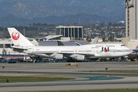 JA8076 @ LAX - Japan Airlines JA8076 taxiing from the International Terminal prior to departure from RWY 25R. - by Dean Heald