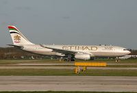 A6-EYF @ EGCC - Etihads fine looking A.330 departing 06L. - by Kevin Murphy