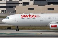 HB-JMG @ LAX - Close-up of Swiss International Airlines HB-JMG (FLT SWR40) on Taxiway Tango after arrival from Zurich (LSZH), Switzerland. - by Dean Heald