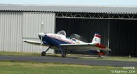 N297NW @ PVG - Framed up by her hangar.  Good looking homebuilt - by Paul Perry
