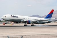 N138DL @ LAS - Delta Airlines N138DL (FLT DAL224) touching down on RWY 25L after a 4hr 10min flight from Hartsfield Jackson Atlanta Int'l (KATL). - by Dean Heald