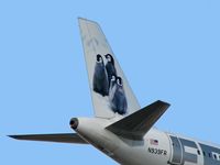 N939FR @ KLAS - Frontier Airlines - 'Penguins' / 2005 Airbus A319-111 - by SkyNevada - Brad Campbell