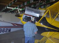 N1017U @ SZP - 1939 Bucker JUNGMANN C.A.S.A. 1.131, Lycoming O-360 180 Hp upgrade, owner/pilot  doing maintenance - by Doug Robertson