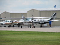 N210GS @ FDK - Taxiing out after a long working the booth at the AOPA Fly-in 2006 - by Sam Andrews