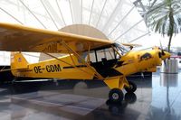 OE-CDM @ SZG - Piper PA-18-150 Super Cub (Flying Bulls) at Hangar 7 - by Norbert Stangl