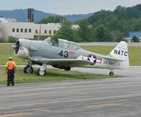 N24554 @ RDG - Pilot and ramp agent give each other the thumbs up as this 1943 SNJ-4 gets ready to thrill spectators at the MAAM 2006 air show. - by Daniel L. Berek