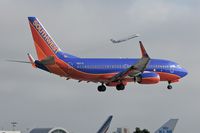 N217JC @ LAX - Southwest Airlines N217JC (FLT SWA2537) from Las Vegas McCarran Int'l (KLAS) seconds from touchdown on RWY 24R. - by Dean Heald