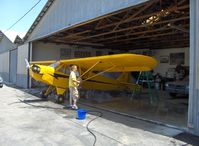N42330 @ SZP - 1941 Piper J3C-65 CUB, Continental A&C65 65 Hp, washing the Cub for the 22nd annual West Coast Piper Cub Fly-In, Lompoc, CA Airport - by Doug Robertson