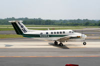 N200EW @ PDK - Taxing past Mercury Air Service - by Michael Martin
