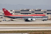 N669US @ LAX - Northwest Airlines N669US (FLT NWA1) taxiing to RWY 25R for departure to Narita Int'l (RJAA). - by Dean Heald