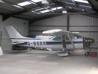 G-BSRR @ EGBT - Cessna 182Q in the hangar at Turweston - by Simon Palmer