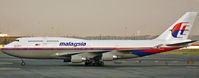 9M-MPK @ EWR - One of Malaysia's elegant 747s taxies past at Newark International Aiport. - by Daniel L. Berek