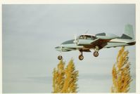 UNKNOWN @ PWK - 1955 Cessna 310, two Continental O-470-M 240 Hp, 'tuna' tanks, on final for PWK, pattern work landing practice. PWK was Palwaukee Airport at the time. - by Doug Robertson