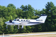 N4057Q @ KASH - Cessna with trunk open on take off at Daniel Webster College Airshow 2005 - by Mark Silvestri