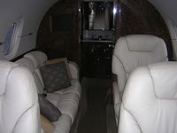 N520SP @ KBLM - couch/bed very comfy for long flights - by William Hughes