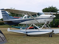 N235HM @ 96WI - Cessna 206 on floats in the north 40 - by Jim Uber