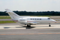 N626CG @ PDK - Taxing past Mercury Air Service - by Michael Martin