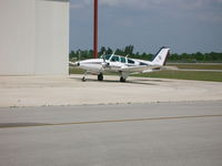 N18333 @ KOBE - waiting for fuel near a big hangar - by flygirlaly