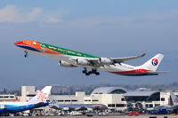 B-6055 @ LAX - China Eastern B-6055 Expo 2010 (FLT CES586) climbing out from RWY 25R enroute to Shanghai Pudong (ZSPD). The China Airlines Dreamliner B-18210 is parked at the Bradley International Terminal, seen just below the nose gear. - by Dean Heald