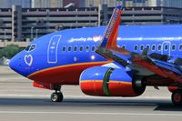 N238WN @ LAS - Close-up of Southwest Airlines N238WN 35th Anniversary - Spreading the LUV (FLT SWA2891) from Ontario Int'l (KONT) rolling out after landing on RWY 25L. - by Dean Heald