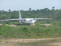 ER-AFH @ MZBZ - AN-24 in the weeds at Belize - by John J. Boling