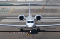 N311CG @ LAX - Taxiing at LAX. - by Dean Heald