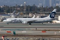 N318AS @ LAX - Alaska Airlines N318AS (FLT ASA279) taxiing to the remote terminal after arrival from Los Cabos Int'l (MMSD). - by Dean Heald