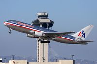 N327AA @ LAX - American Airlines N327AA (FLT AAL242) climbing out from RWY 25R enroute to John F Kennedy Int'l (KJFK). - by Dean Heald