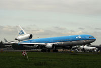 PH-KCE @ AMS - PH-KCE  MCD MD-11  KLM  AMS 13/10/06 landing on runway 06 - by Mark Giddens