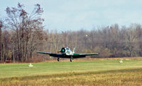 N29678 @ D51 - Yes, you can still fly a T-6 from a small, wet grass strip just north of Buffalo in November - by Jim Uber