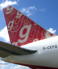 G-CEFG @ NZAA - Beautiful tail colours of FlyGlobespan B763 - by Graeme Thompson